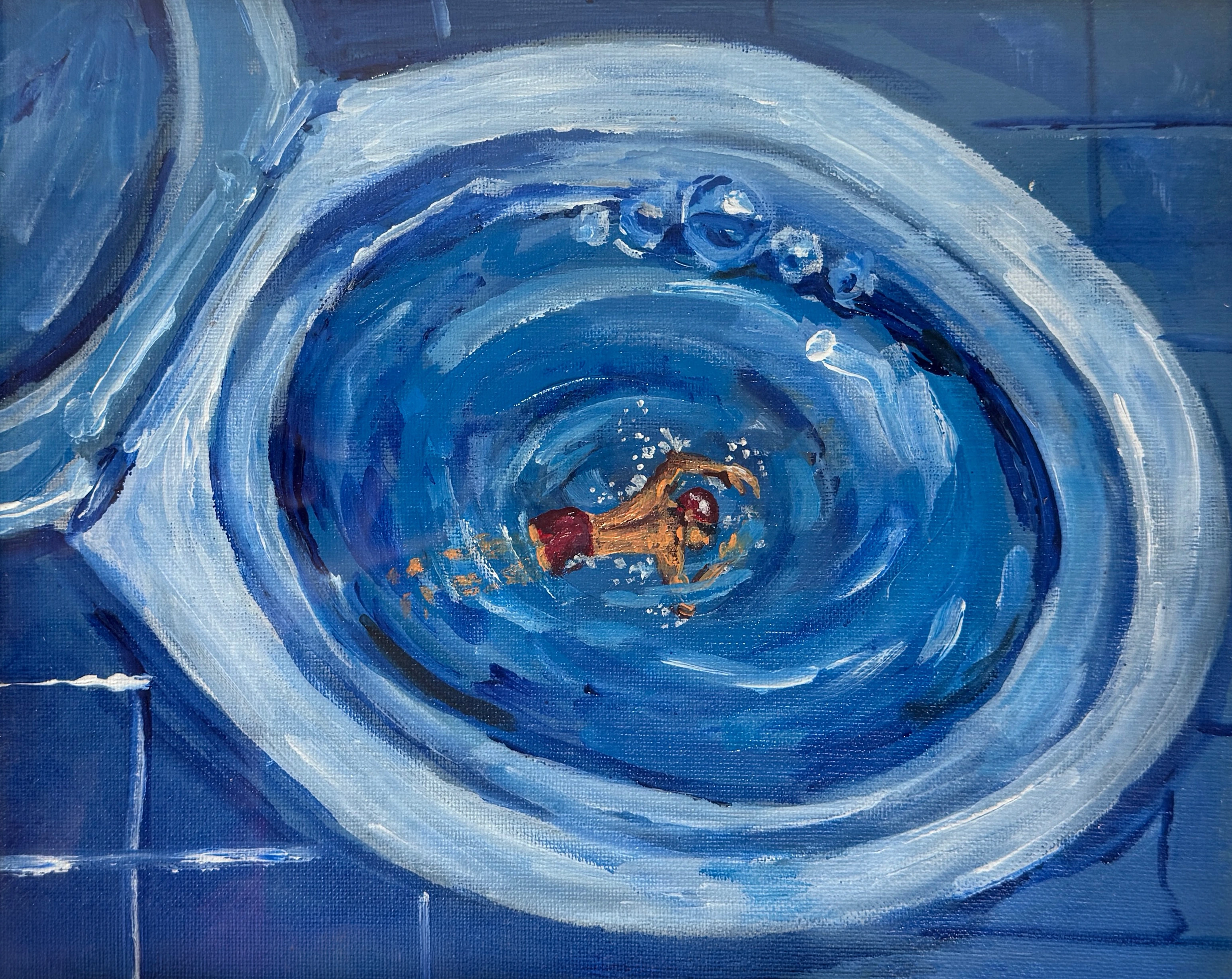 A small swimmer doing laps in a toilet bowl.