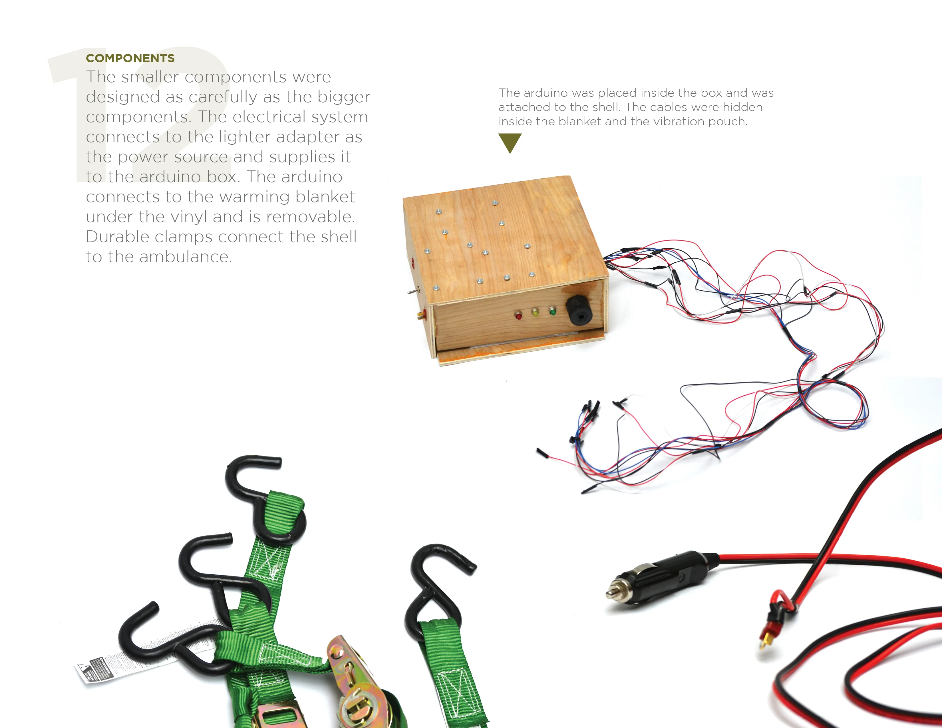 Various electronic and mechanical components including a wooden Arduino box with wires, green straps with hooks, and a car lighter adapter.