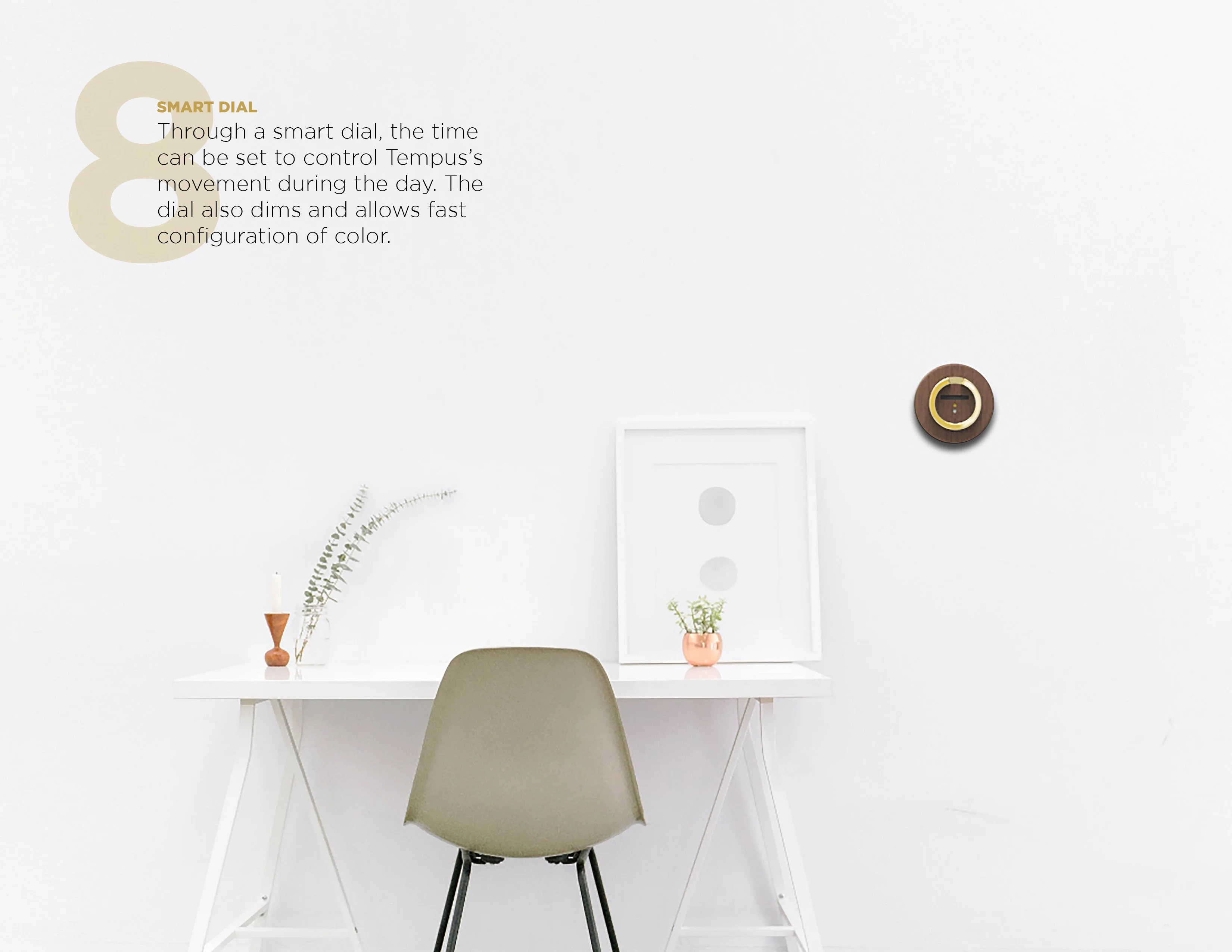 Minimalist desk setup with a smart dial on the wall.